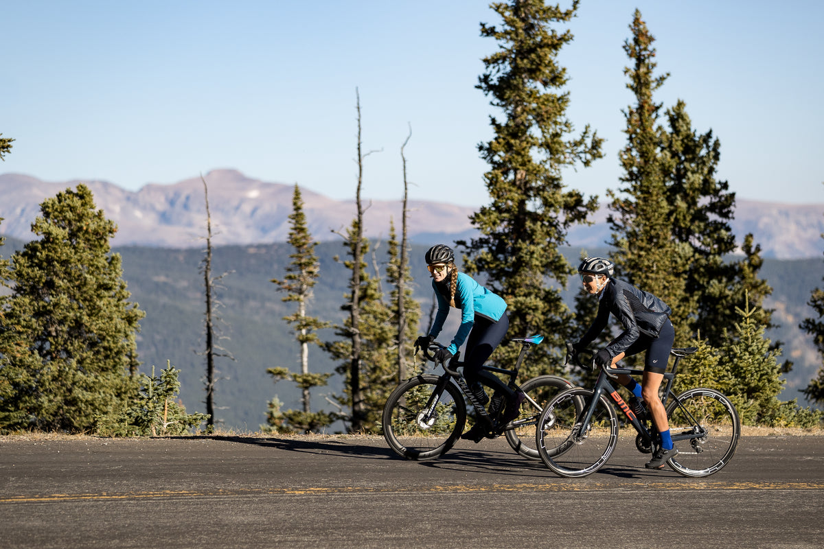 Women climbing on road bikes